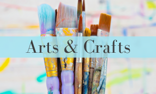 Background image is a bunch of paintbrushes of different sizes. There is a blue banner in the middle with the words Arts & Crafts. 